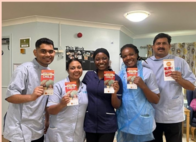 staff holding flyers on sepsis