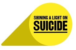 yellow logo shaped like a spotlight with black text