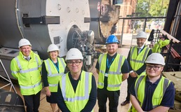 the mayor wearing a hard hat and high vis jacket with other people