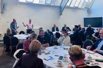 Members of the armed forces community sat round tables in discussion