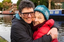 Two women hugging and smiling