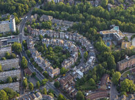 Curving residential street with surrounding trees