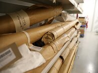 Rolls of records on shelves at West Yorkshire Archive Service