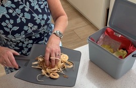 Food waste being put into bin