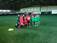 Pupils participate in the Double Club event at Arsenal training ground, which featured football and literacy challenges.