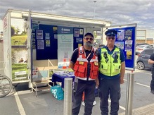 Police and Community Enforcement Officer outside the CSP Trailer 