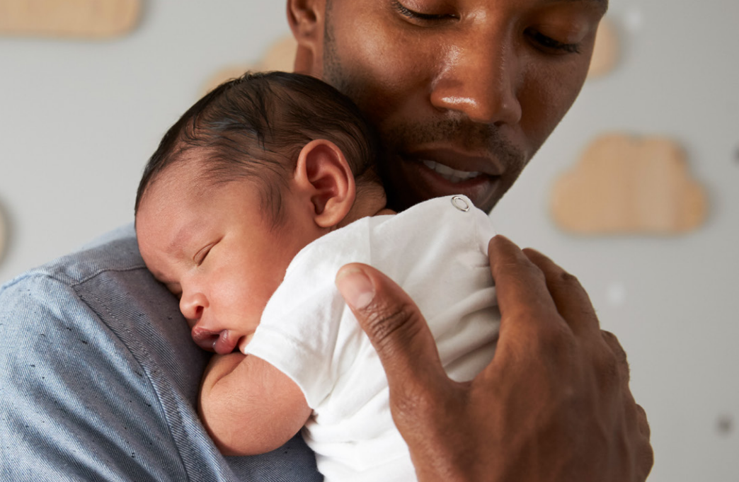 A man holding a baby