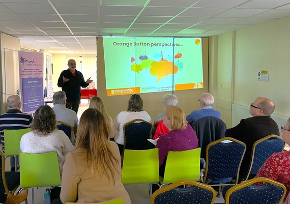 An image from an Orange Button community meeting