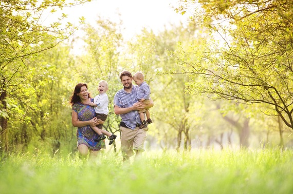 a family walking in a field together