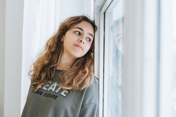 a child looking out of a window