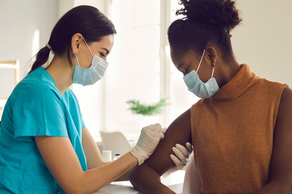 a lady getting vaccinated