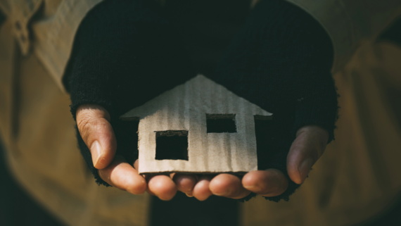 the shape of a house made of cardboard