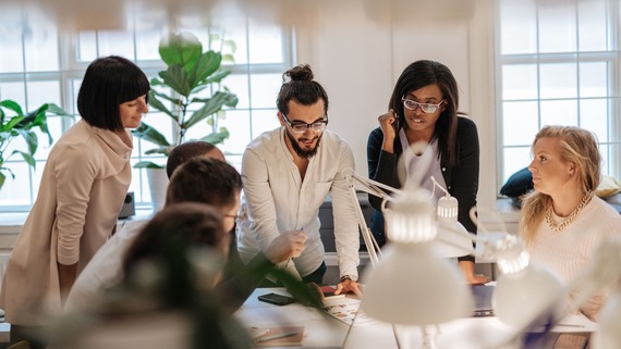 a group of people brainstorming a project together