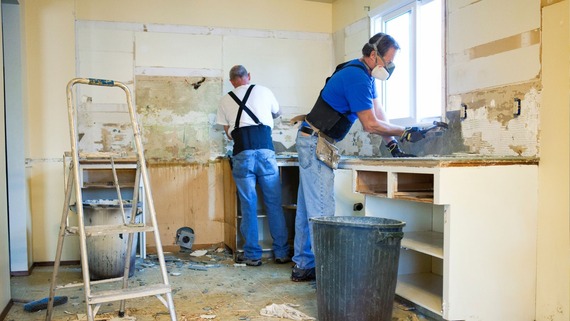 two men doing repair work