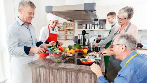 elderly people cooking together