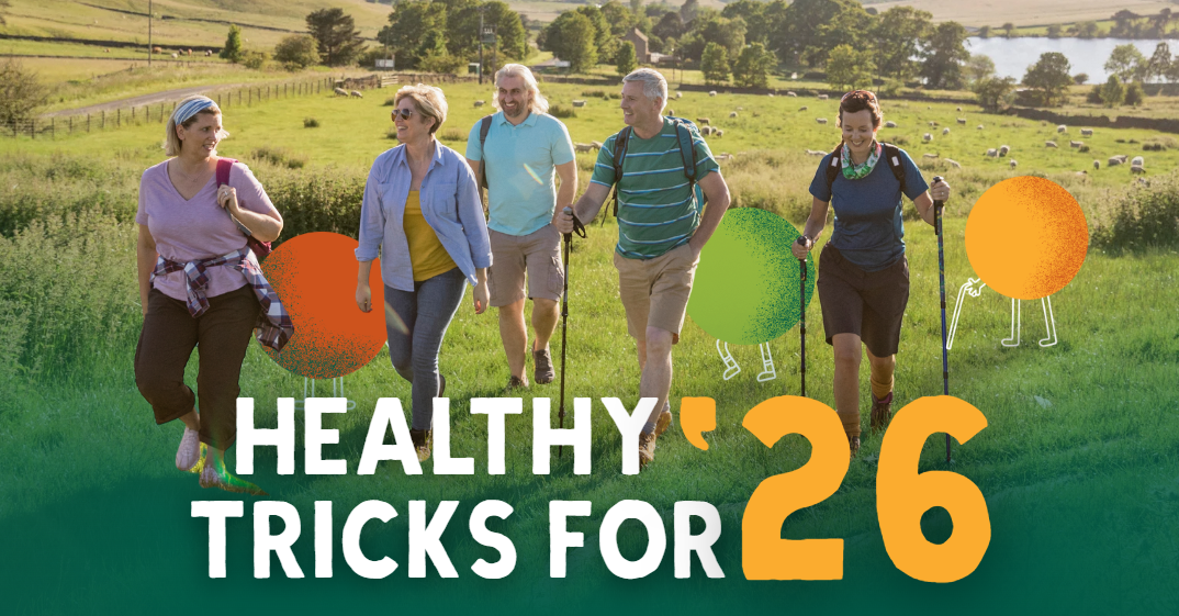 a group of people walking through a field