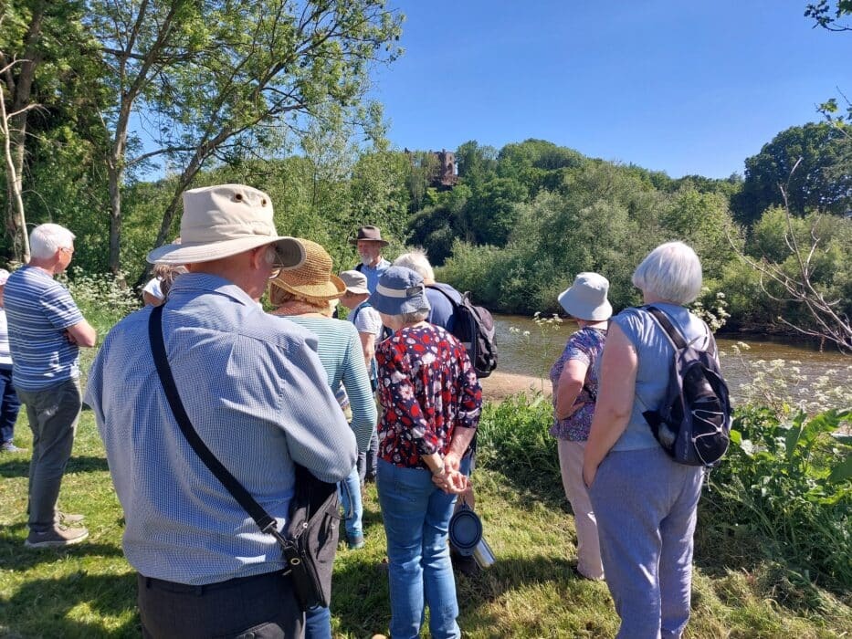 a walking group next to the river wye