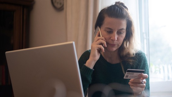a woman calling the bank holding her credit card