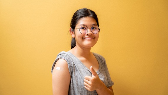 a girl with a plaster on her arm