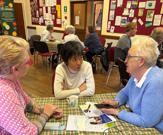 attendees sat talking together at the Staunton Hub