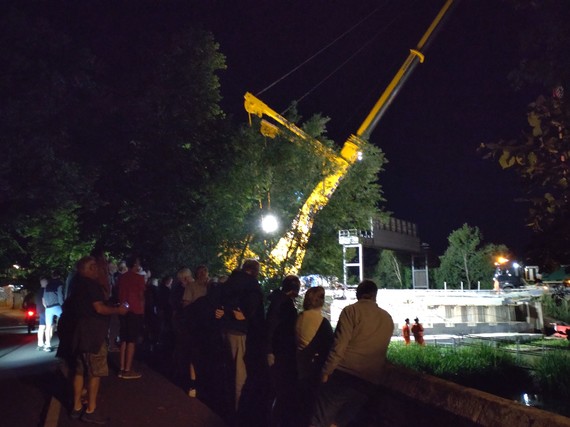 Crowds watching the beam lift from West Street