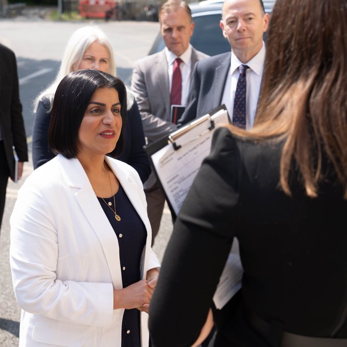 Lord Chancellor Shabana Mahmood talking to people outside in the sunshine