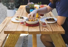 Person eating at an outside table