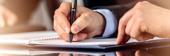 hand signing a document