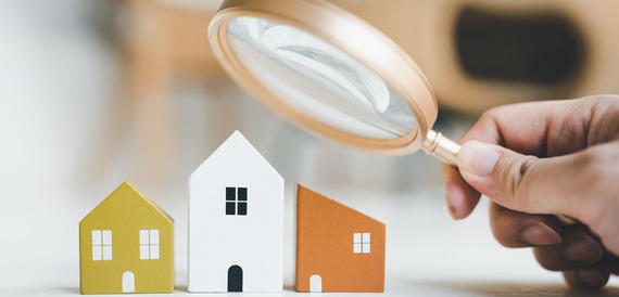 houses under magnifying glass
