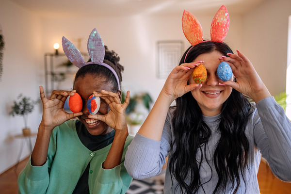 two children playing with easter eggs