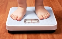 Photo of child on scales