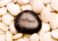 reflect printed on a sea pebble