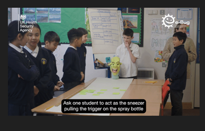 A picture of students doing the Snot gun experiment in the classroom