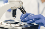 picture of lab worker and microscope