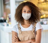 young hospitality worker wearing mask