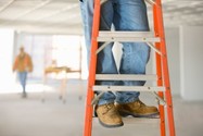 worker climbing ladder