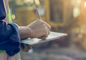 Employee holding clip board