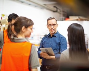 Manager talking to employees