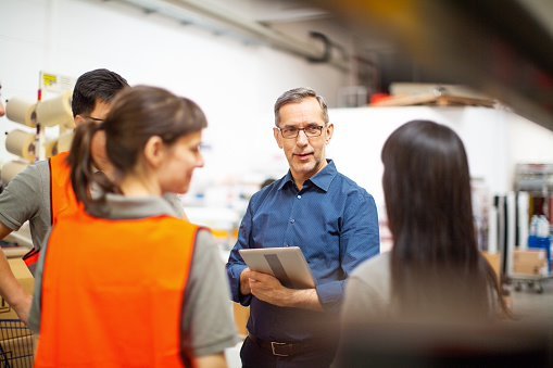 Manager talking to employees