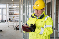 HSE inspector writing in notebook