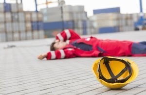 worker lying down after fall to the ground