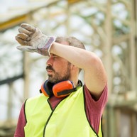 male worker feeling the heat