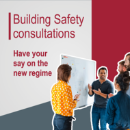 workers stood around a whiteboard