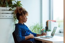 pregnant worker working on laptop