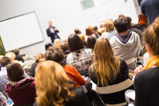 Delegates attending training course with traininer presenting at front