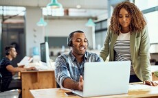 2 office workers at a desk