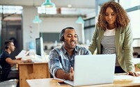 office workers collaborating at desk