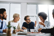 4 colleagues in an office meeting