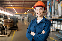 female worker in warehouse wearing PPE