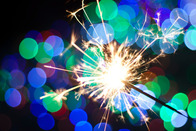 sparklers being held in the night sky